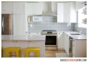 DIY Kitchen Renovation White Cabinets, Quartz Countertops, Yellow Stools