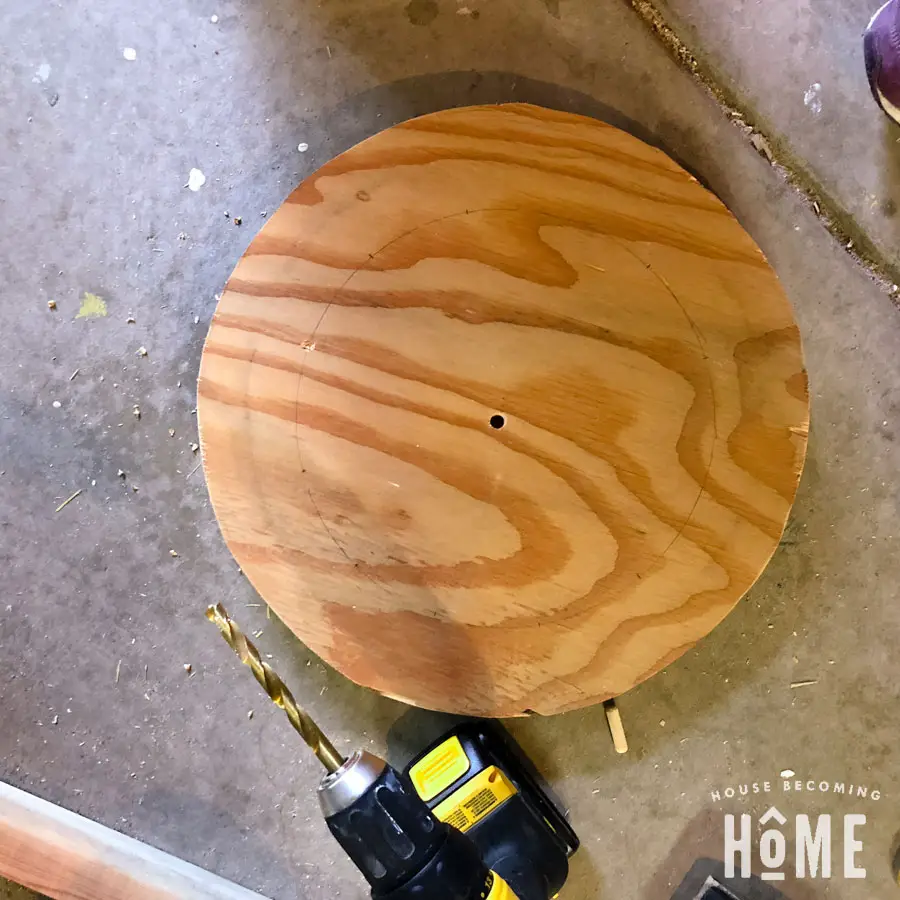 scrap wood clock with hole drilled in middle