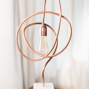 Modern Light made from Twisted Copper pipe on marble and oak base