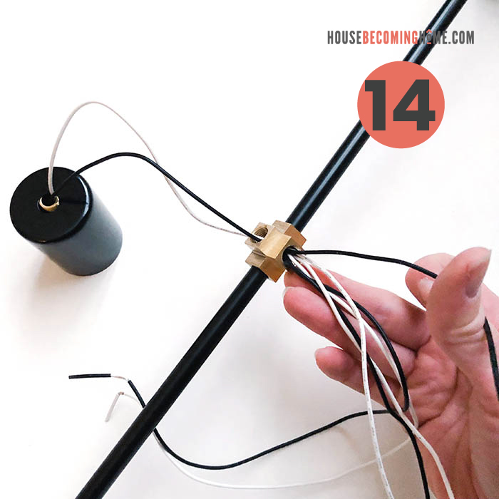 How to make a modern bathroom light fixture. Wires from light socket going through black pipe.