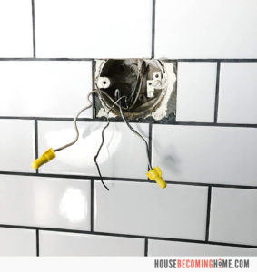 Replacing a bathroom light fixture. Black, white and copper wires in wall.