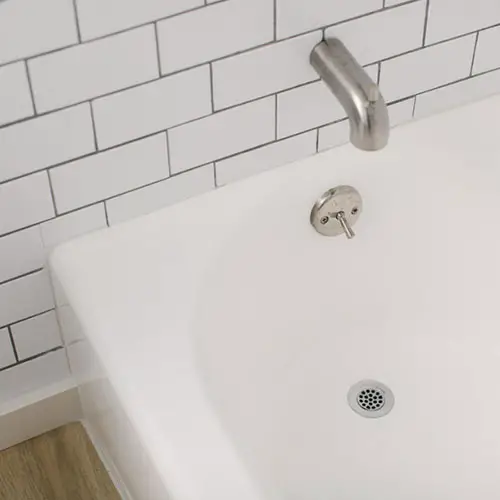 DIY Bathtub Refinish. Paint an almond bathtub white with an affordable refinishing kit.