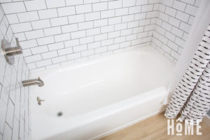After painting an almond bathtub with white tub and tile refinishing kit