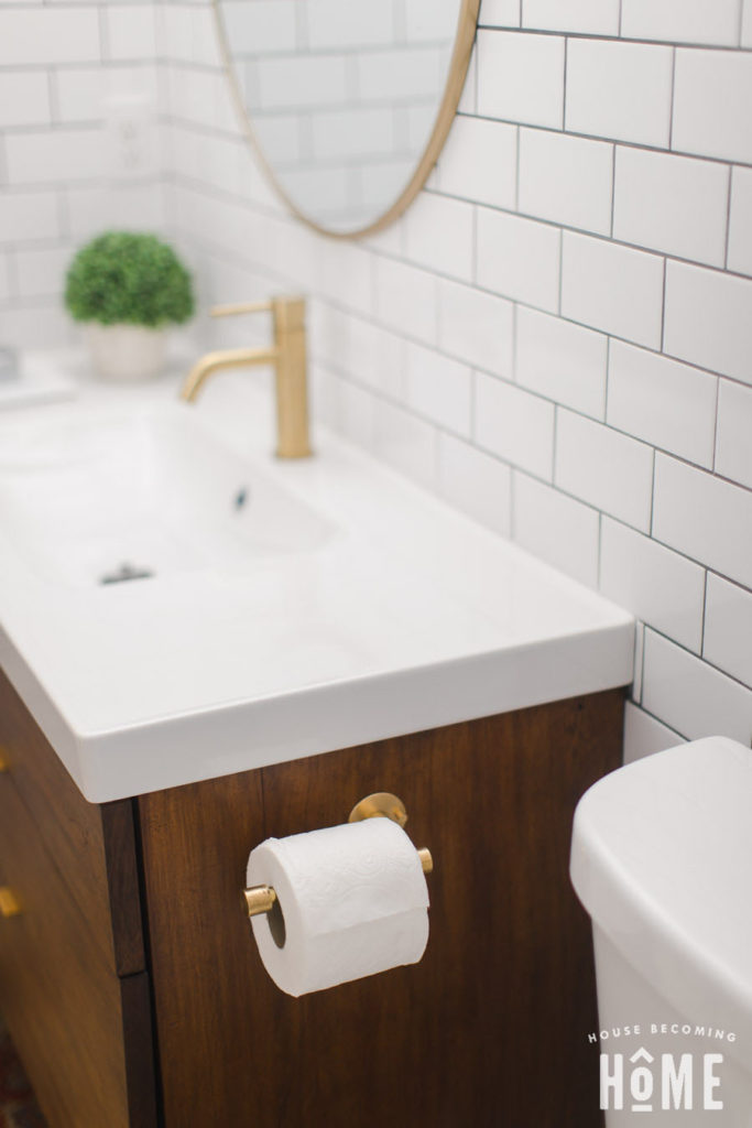 Finished Brass Toilet Paper Holder Mounted to Vanity - House Becoming Home