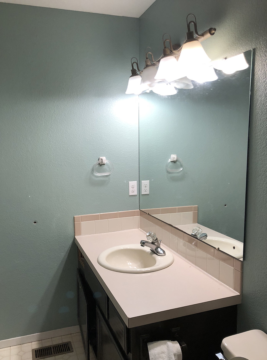 Small Bathroom Renovation Before: Builder Grade Bathroom sink and countertop