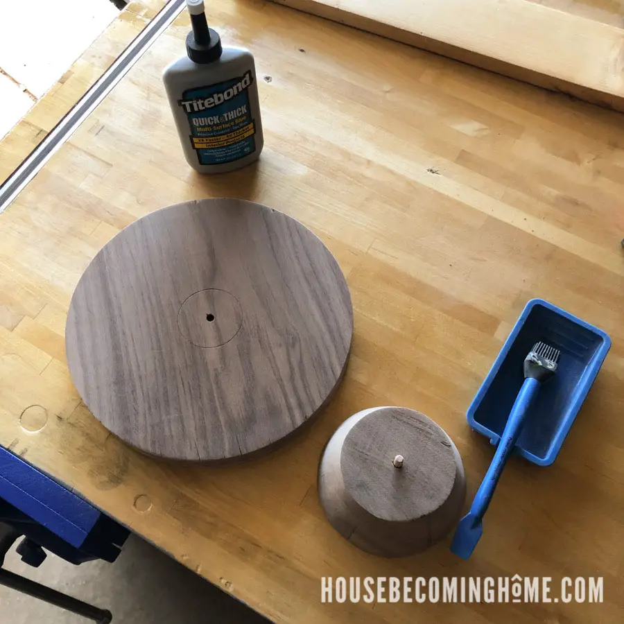 Putting the wood cake stand together with wood glue and a dowel