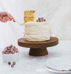 Serving Cranberry-Orange Cake from a Wooden Cake Stand