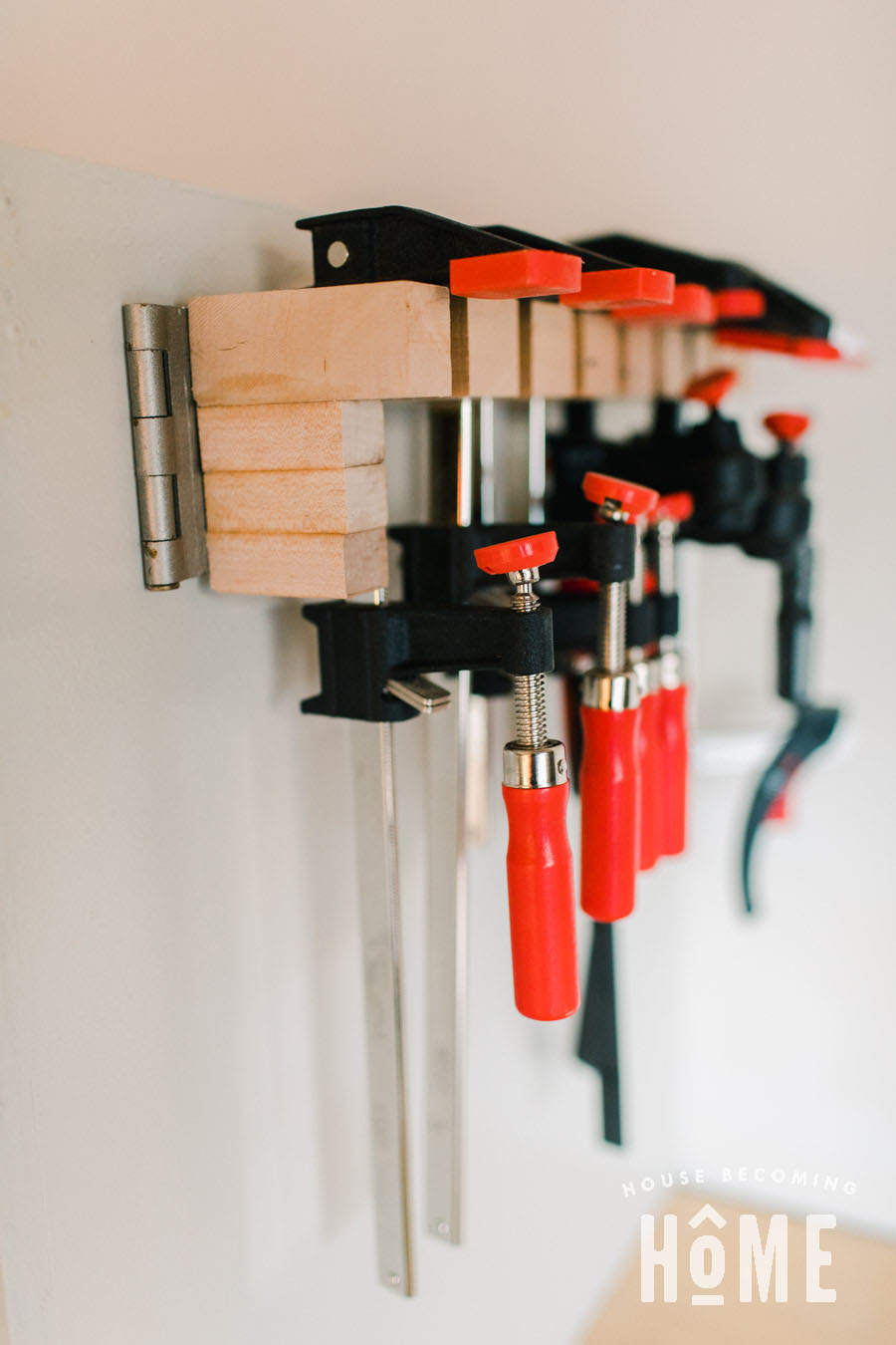 Hinged clamp rack for a small garage workshop