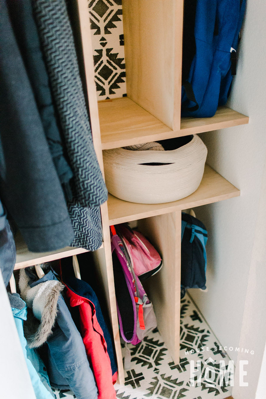 After Reorganizing Coat Closet with Dividers and Baskets